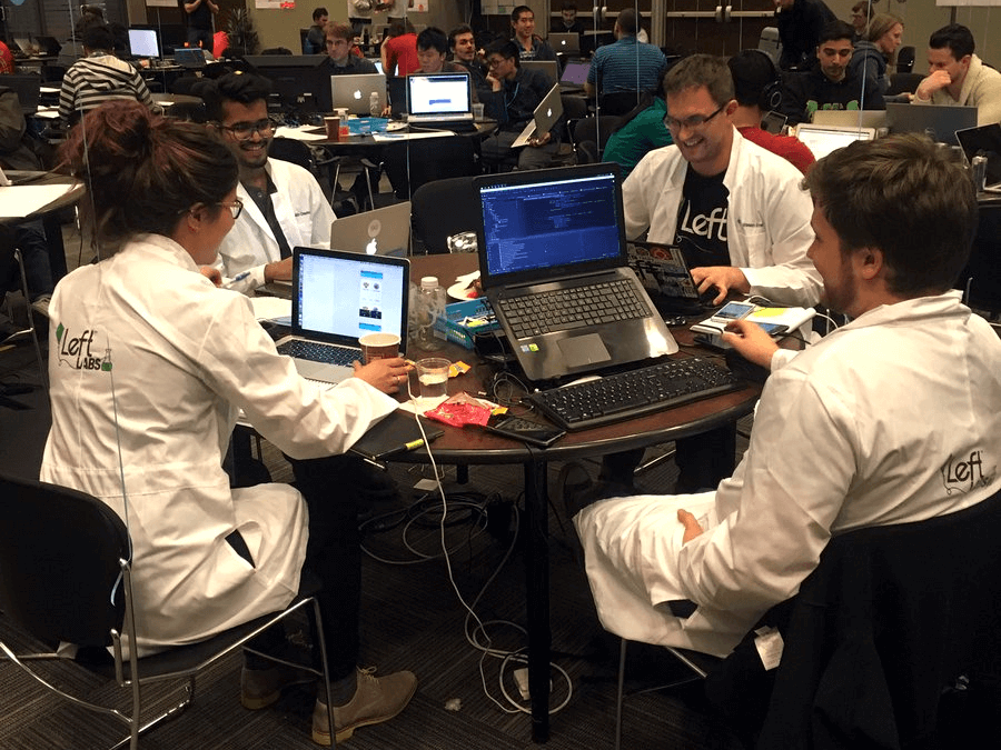 Some folks from Left at a Hackthon in 2017, rocking labcoats for some serious computer science!